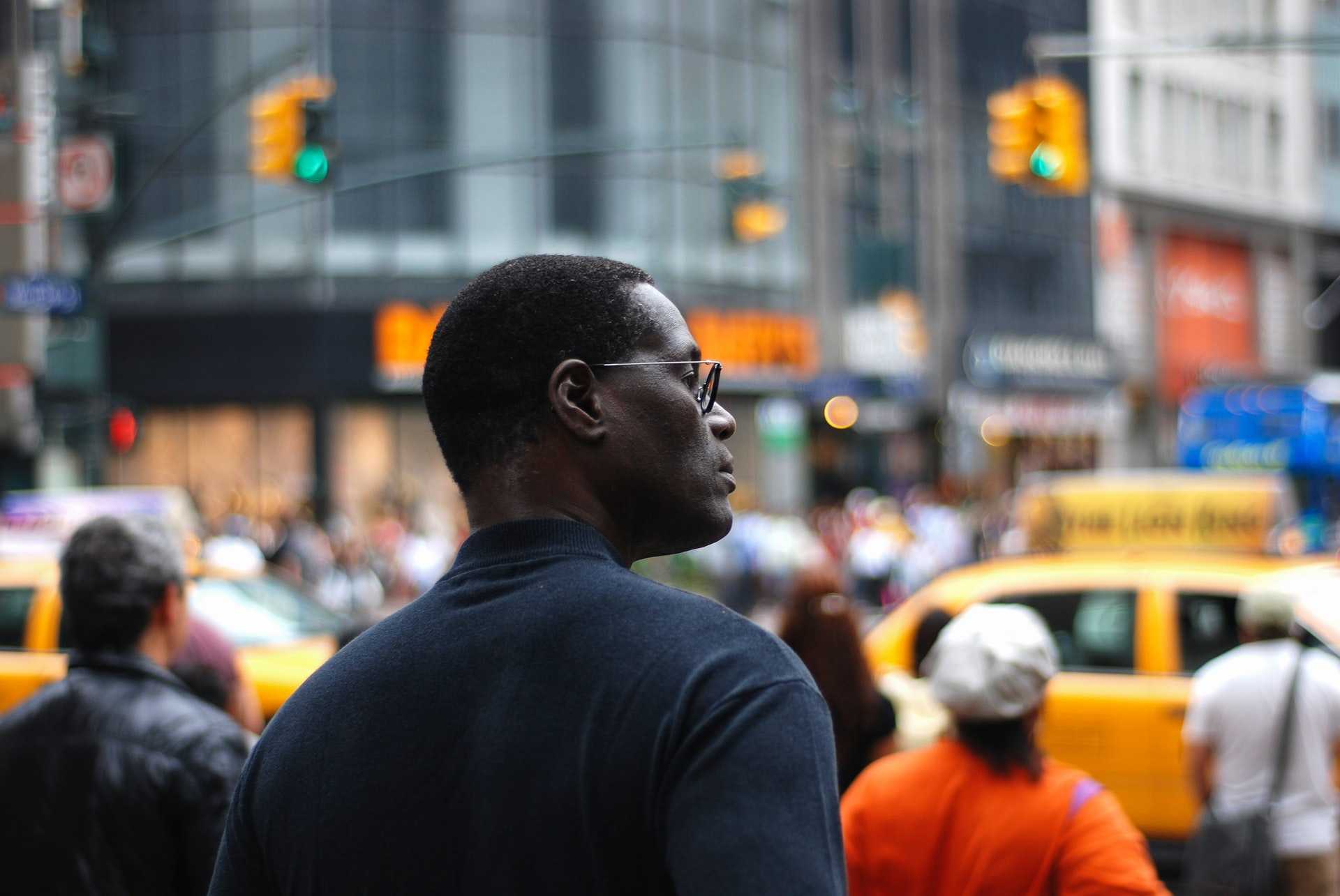 A young black man gazing